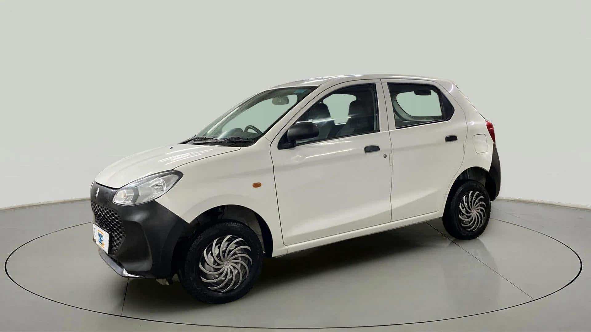Front side view of a metallic solid white Maruti Suzuki Alto K10