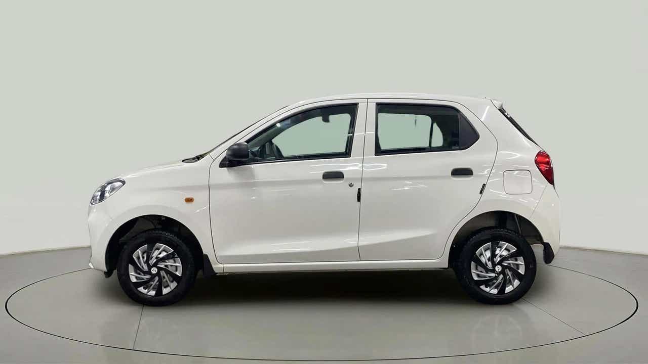 Side view of a metallic solid white Maruti Suzuki Alto K10