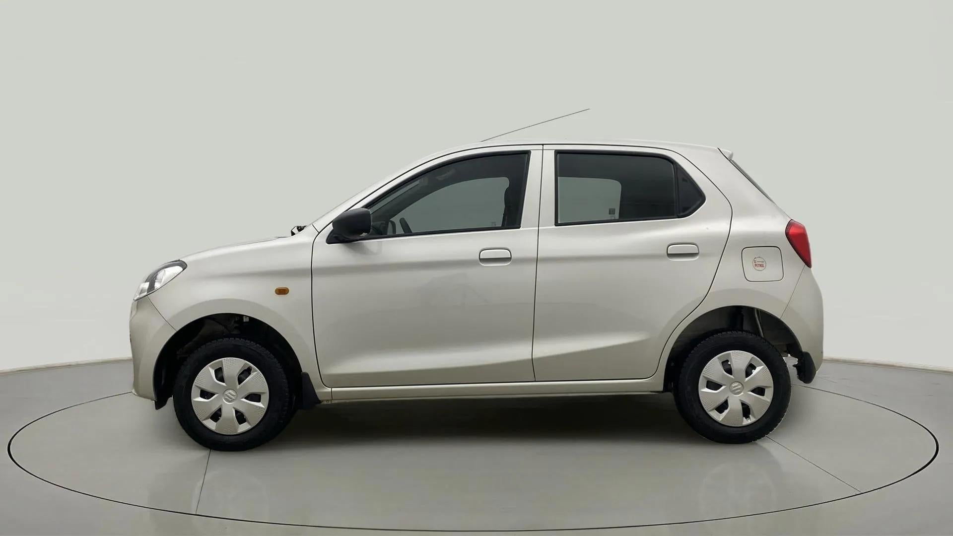 Side view of a metallic solid white Maruti Suzuki Alto K10
