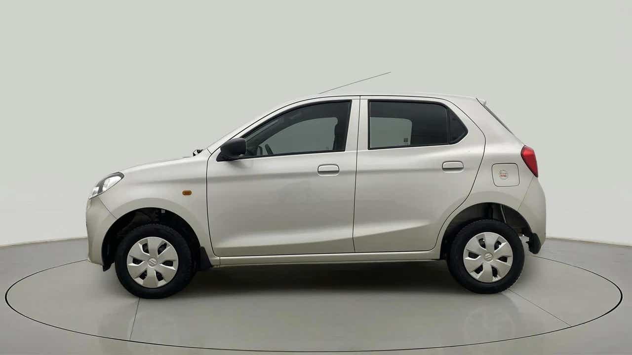 Side view of a metallic solid white Maruti Suzuki Alto K10