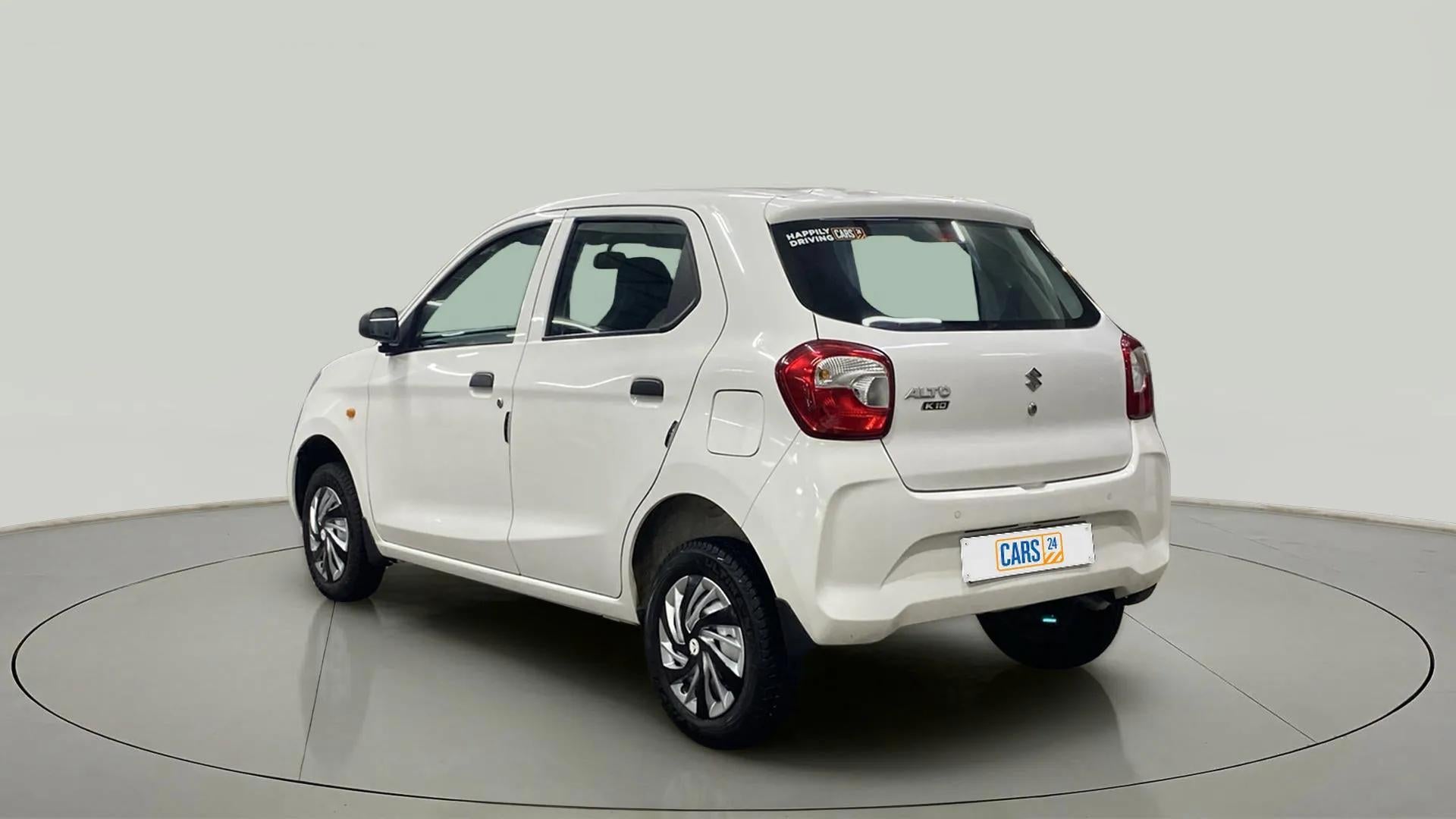 Rear three-quarter view of a metallic solid white Maruti Suzuki Alto K10
