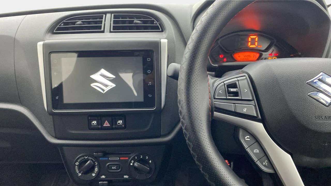 Interior dashboard view of a Maruti Suzuki Alto K10