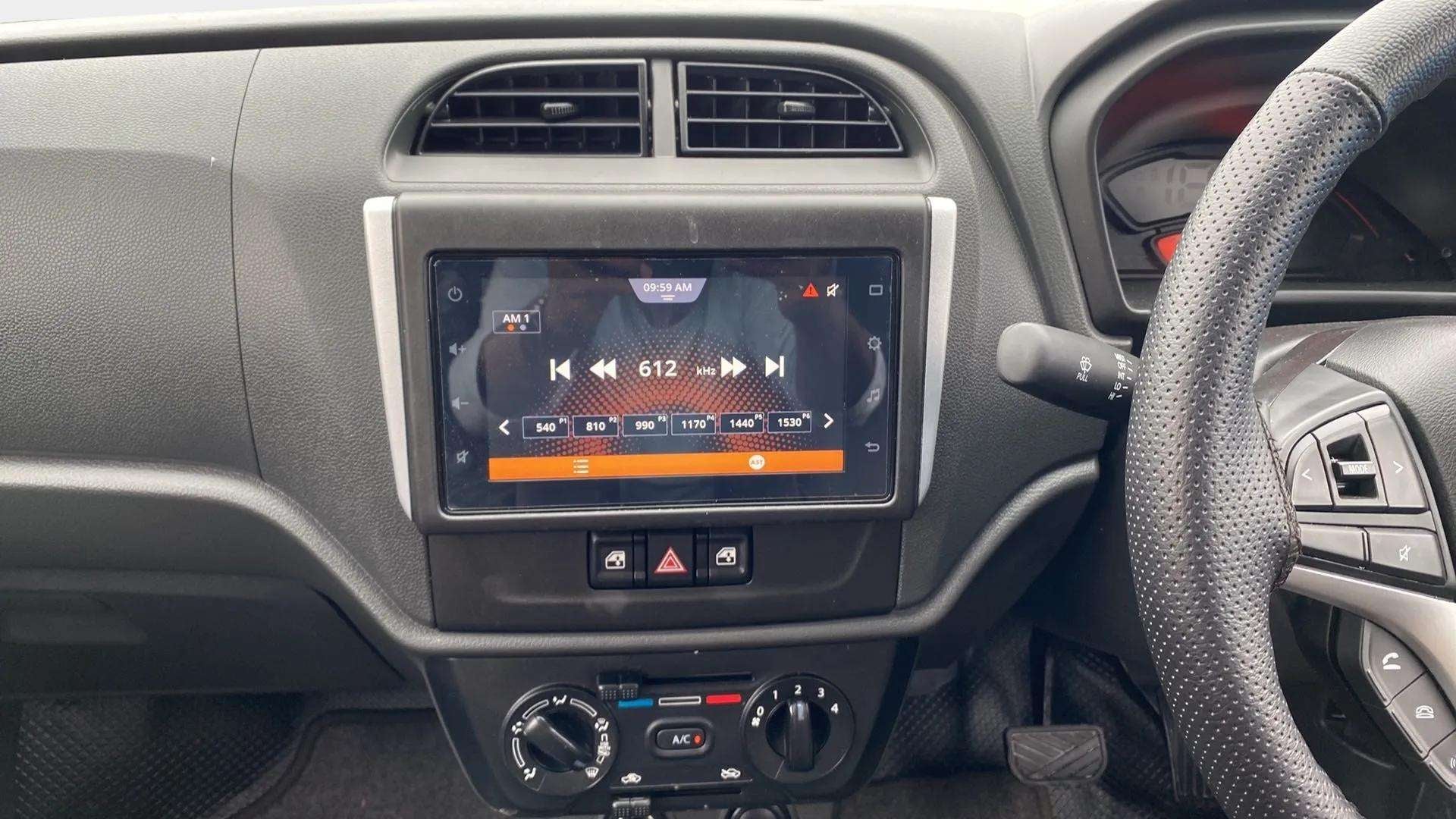 Interior dashboard view of a Maruti Suzuki Alto K10