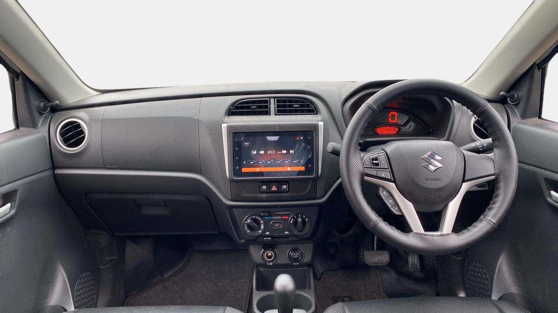 Interior dashboard view of a Maruti Suzuki Alto K10