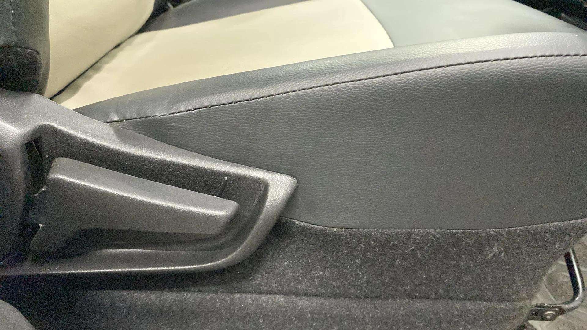Close-up of the seat adjustment lever of a Maruti Suzuki Alto K10
