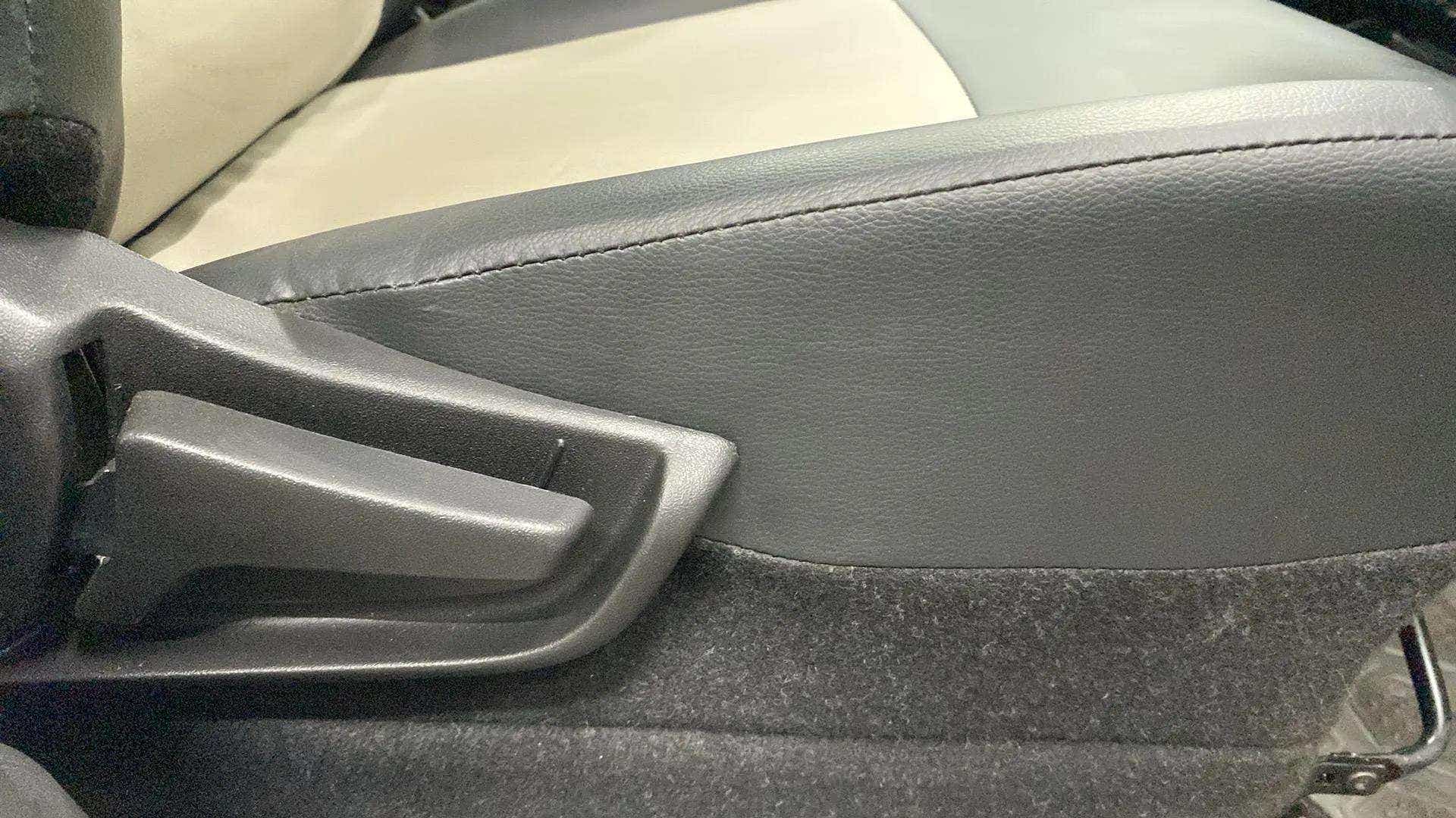 Close-up of the seat adjustment lever of a Maruti Suzuki Alto K10