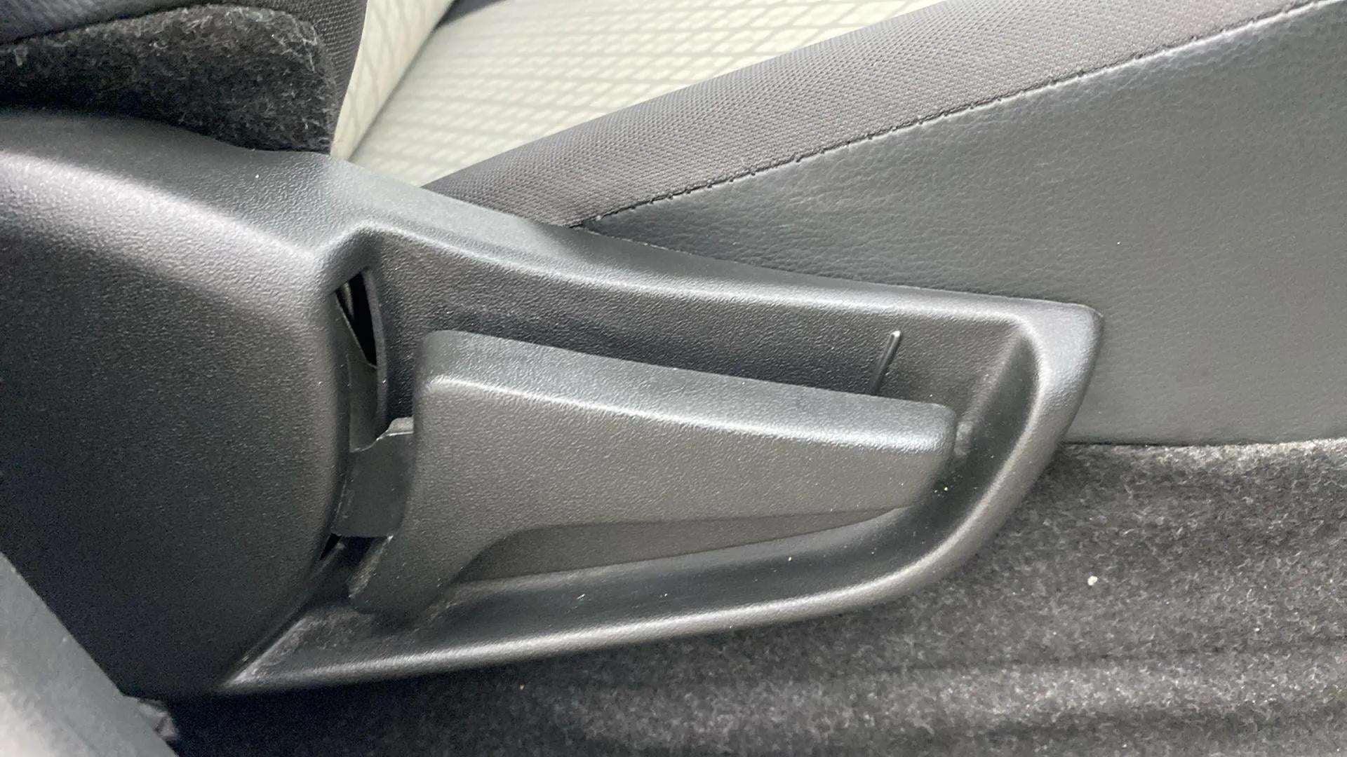 Close-up of seat adjustment lever of a Maruti Suzuki Alto K10