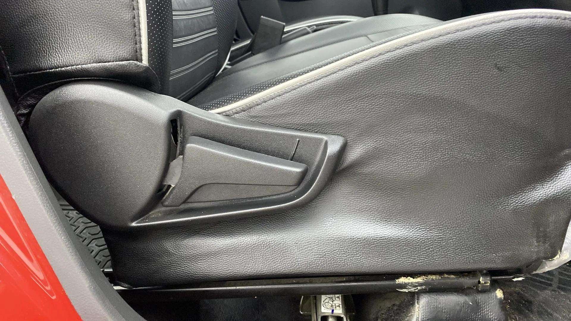 Side view of a seat adjustment lever of a Maruti Suzuki Alto K10