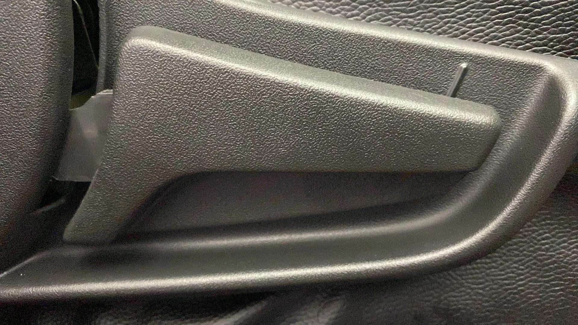Close-up of an interior door handle of a Maruti Suzuki Alto K10