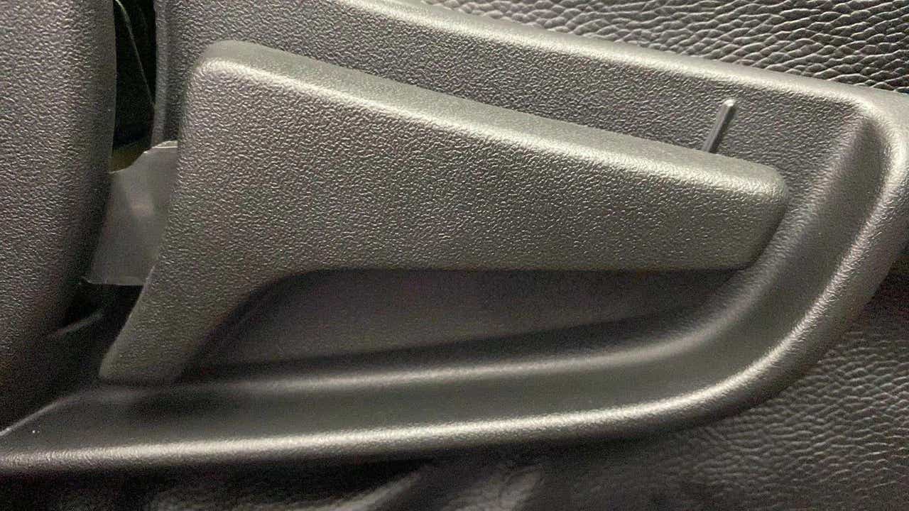 Close-up of an interior door handle of a Maruti Suzuki Alto K10