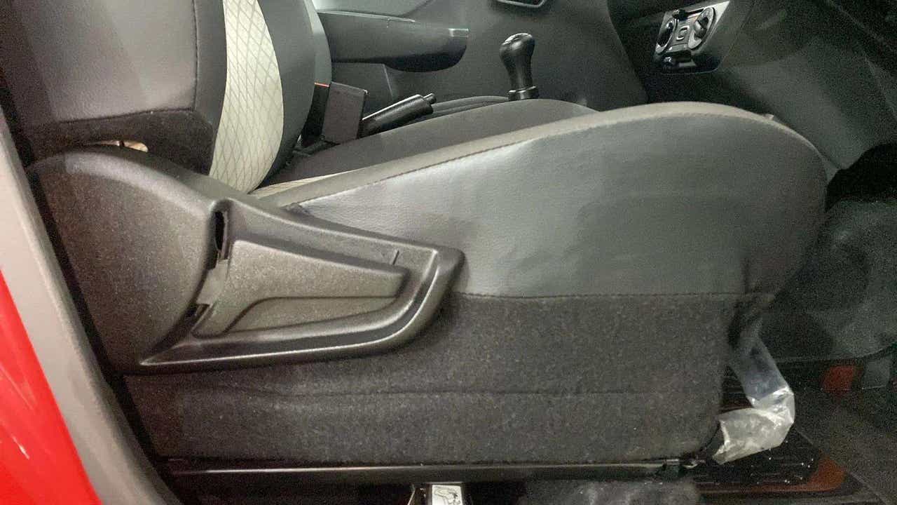 Side view of the front seat adjustment lever of a Maruti Suzuki Alto K10
