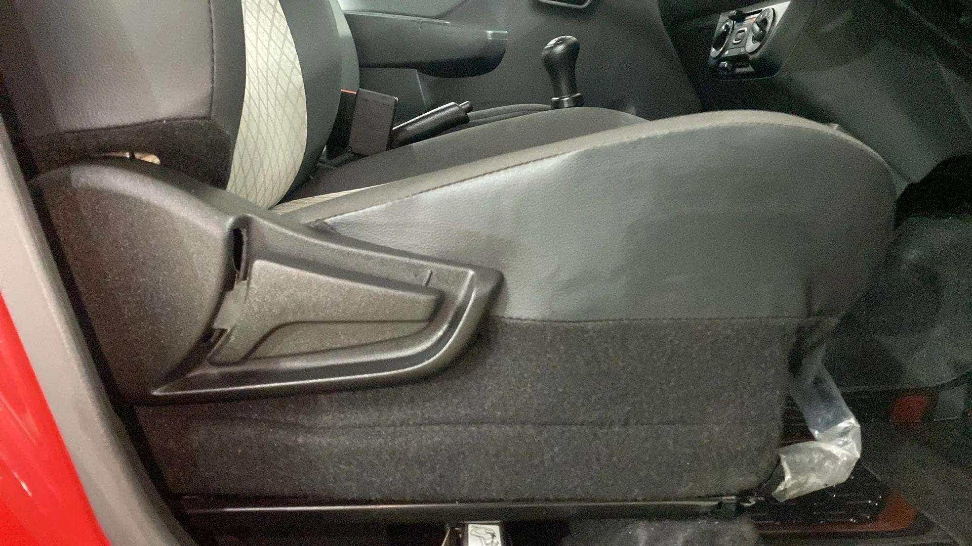 Side view of the front seat adjustment lever of a Maruti Suzuki Alto K10