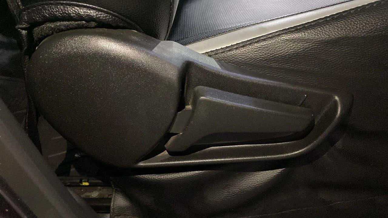 Close-up of a seat adjustment lever of a Maruti Suzuki Alto K10