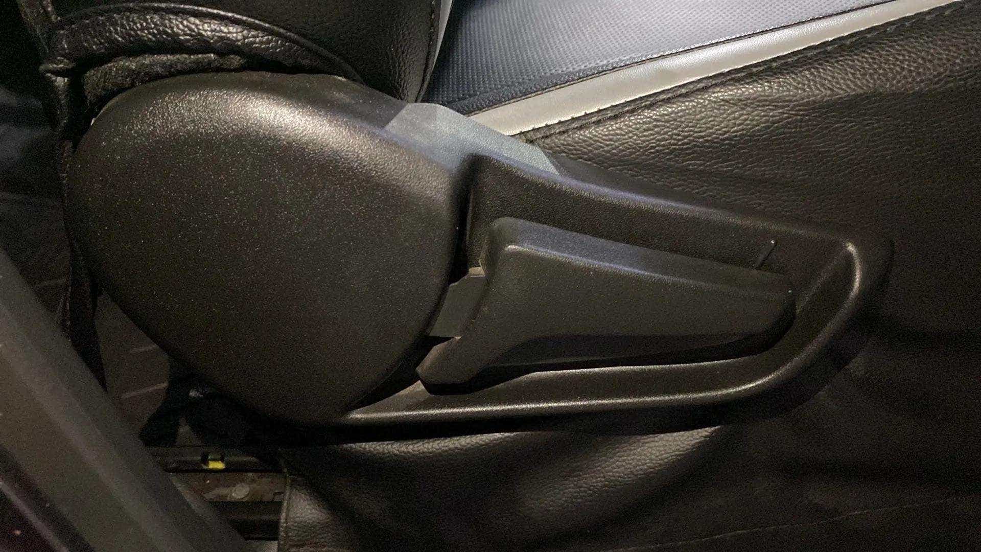 Close-up of a seat adjustment lever of a Maruti Suzuki Alto K10