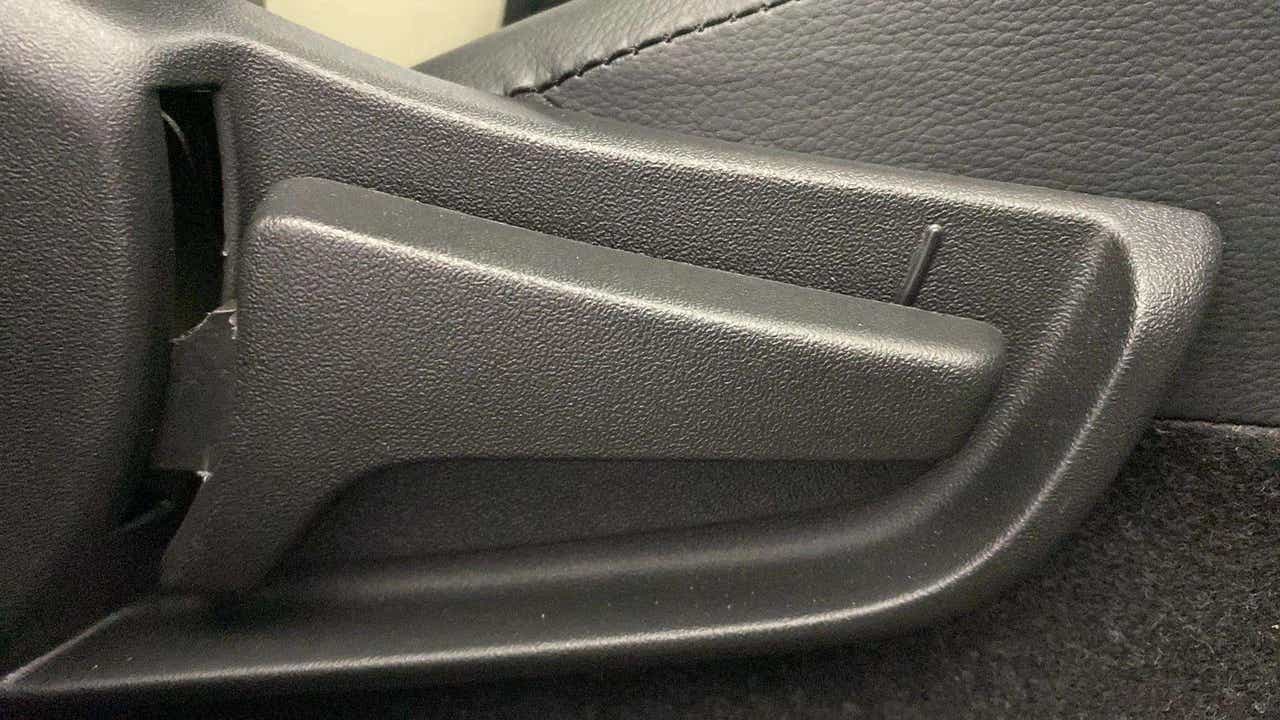 Seat adjuster lever of a Maruti Suzuki Alto K10