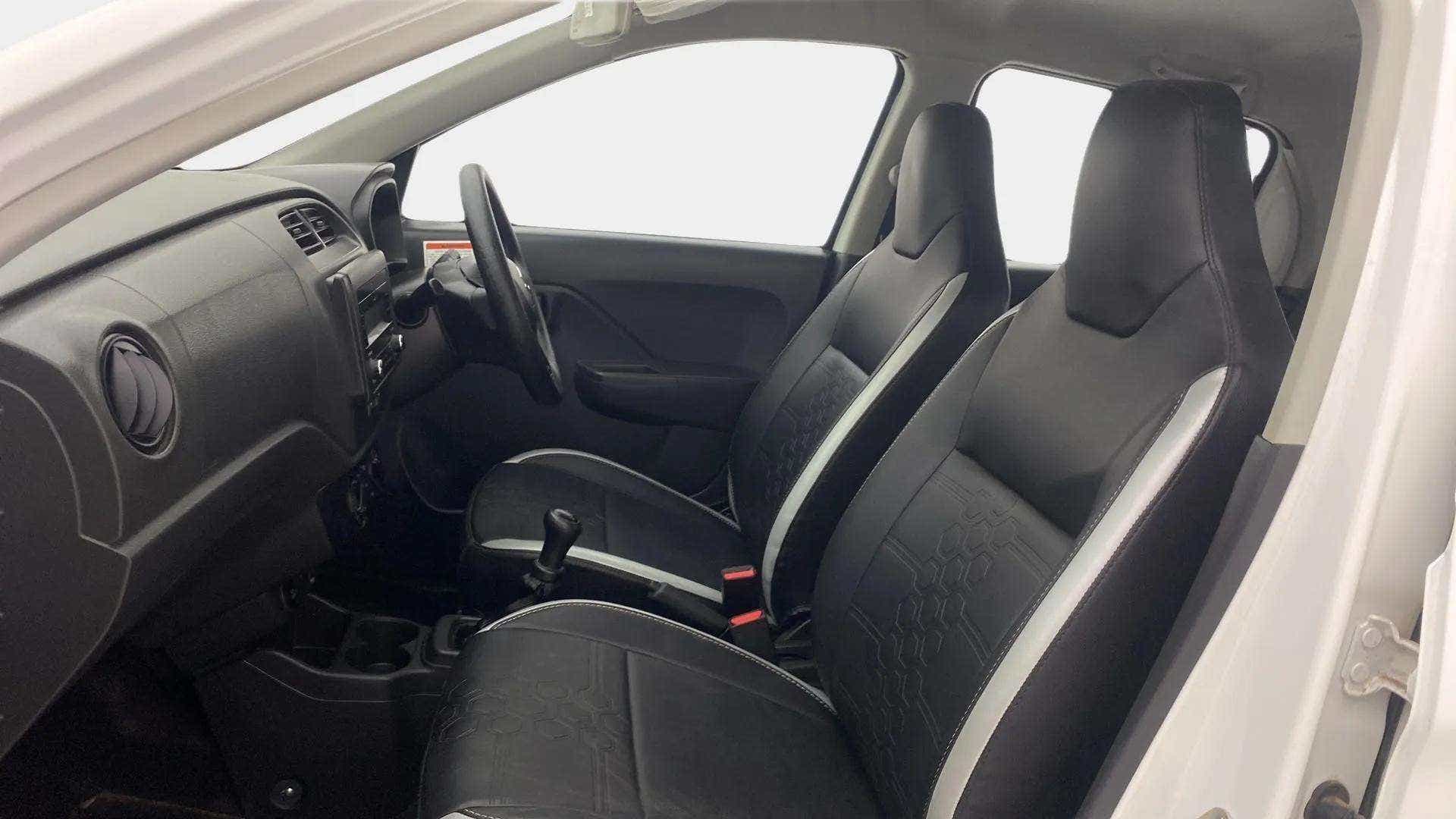 Interior dashboard and front seats of a Maruti Suzuki Alto K10