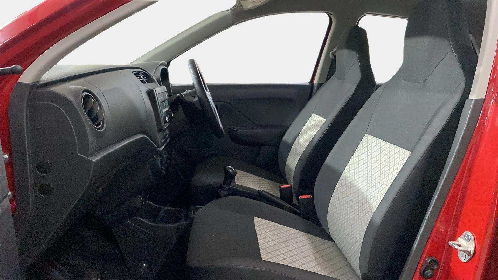 Interior dashboard and front seats of a Maruti Suzuki Alto K10