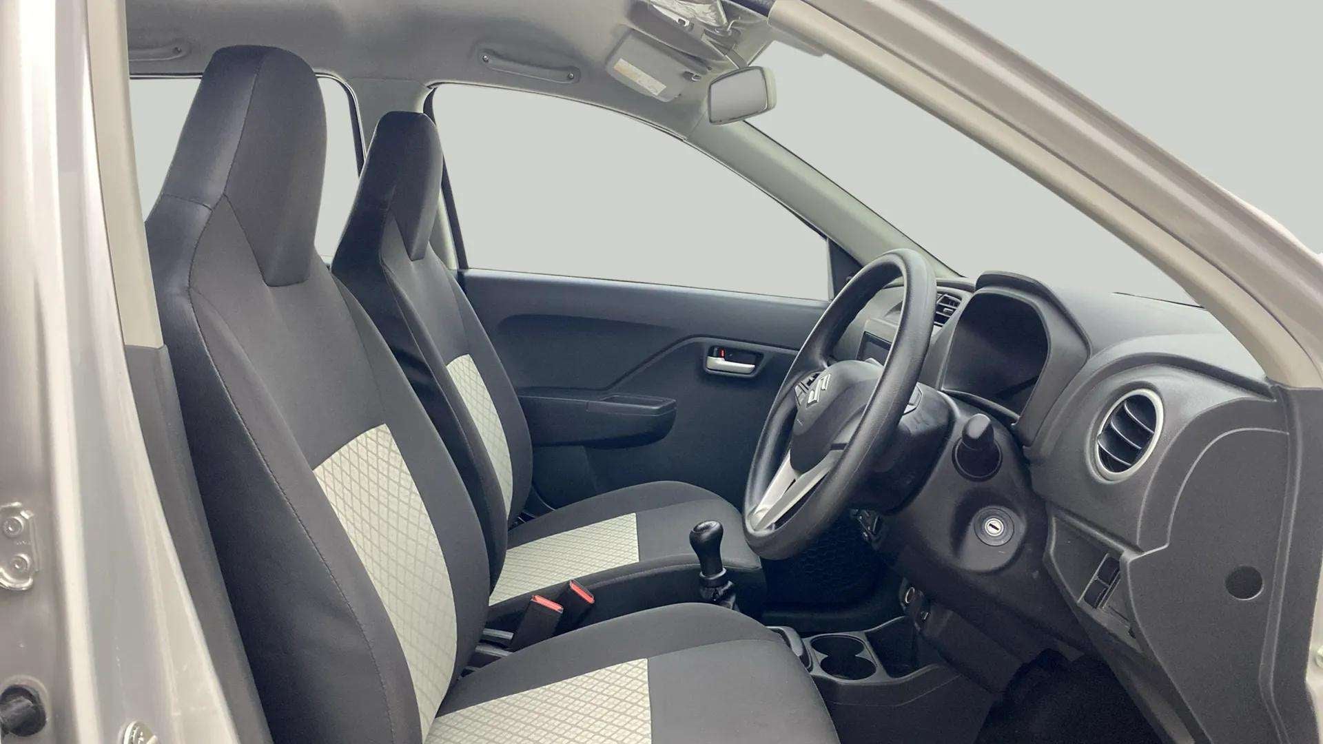 Interior dashboard and front seats of a Maruti Suzuki Alto K10