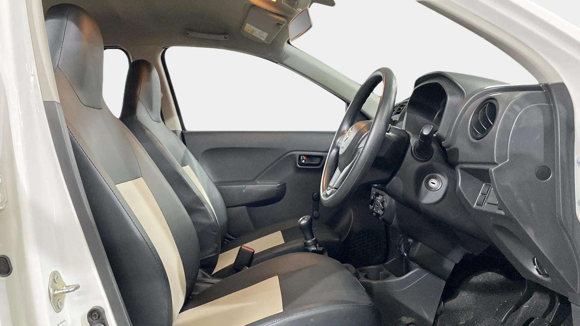 Interior front seats and dashboard view of a Maruti Suzuki Alto K10