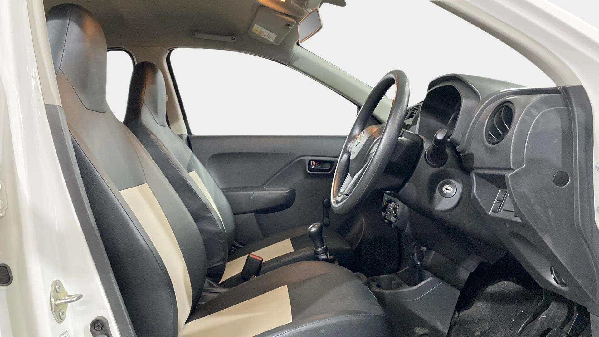 Interior front seats and dashboard view of a Maruti Suzuki Alto K10