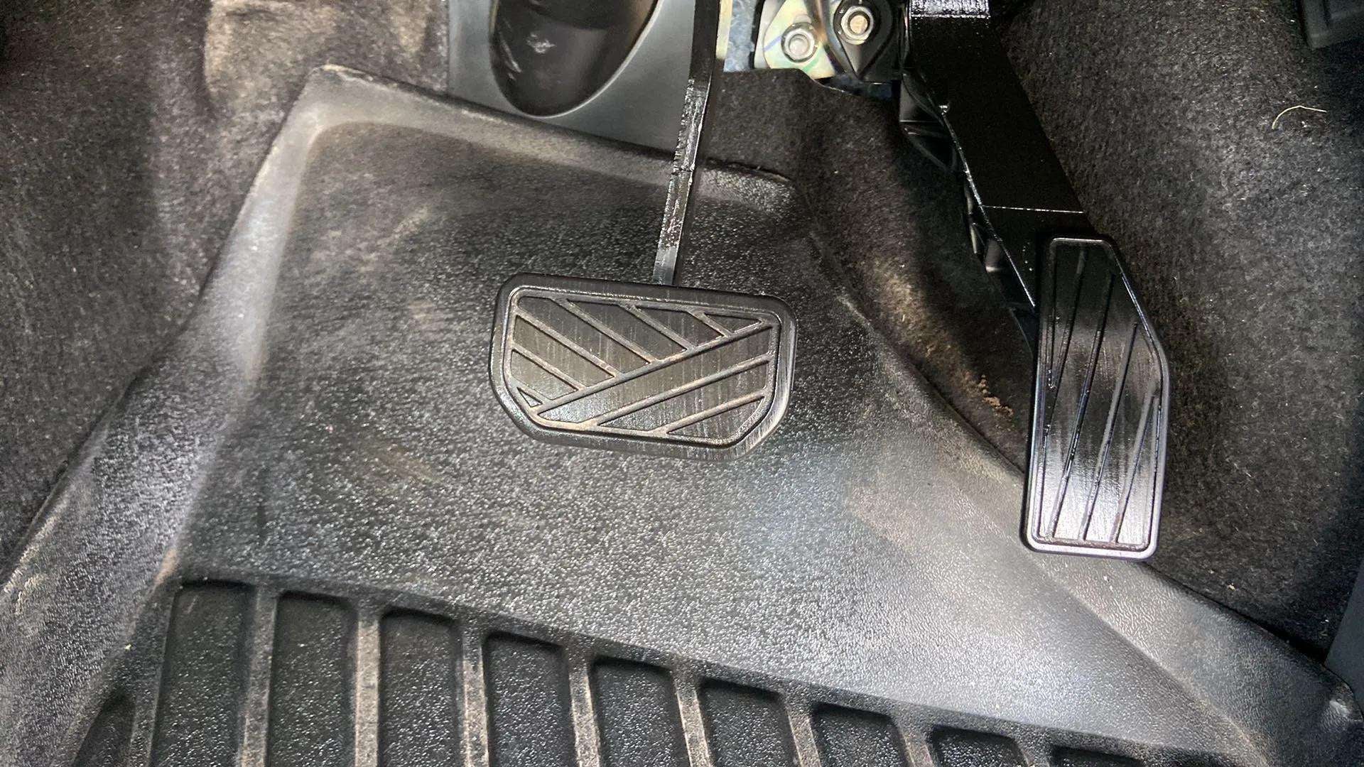 Footwell area with brake and accelerator pedals of a Maruti Suzuki Alto K10