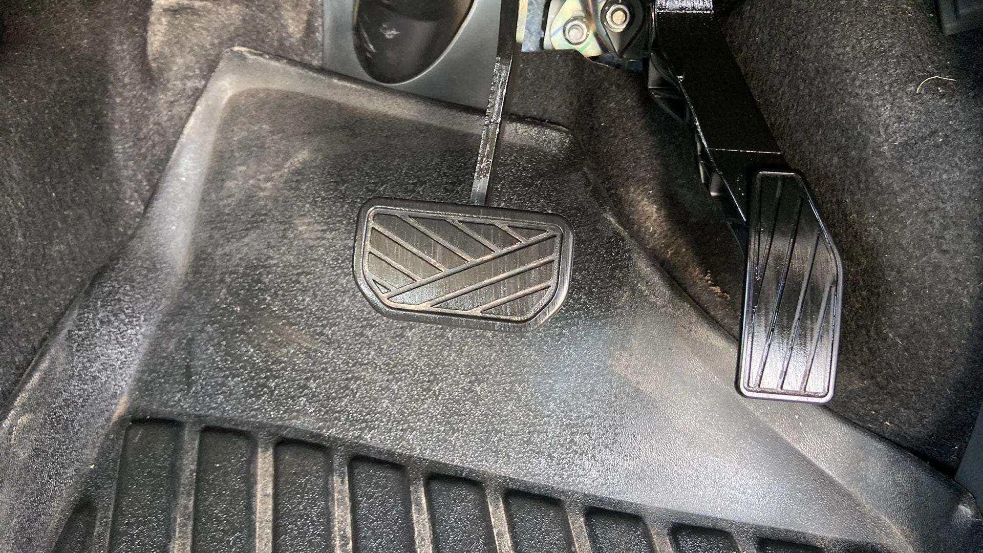 Footwell area with brake and accelerator pedals of a Maruti Suzuki Alto K10