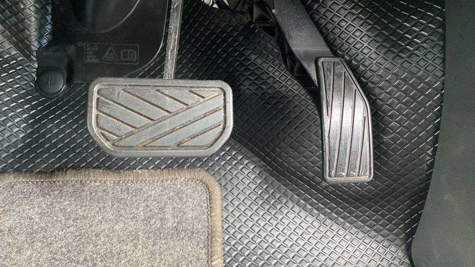 Footwell view showing pedals of a Maruti Suzuki Alto K10