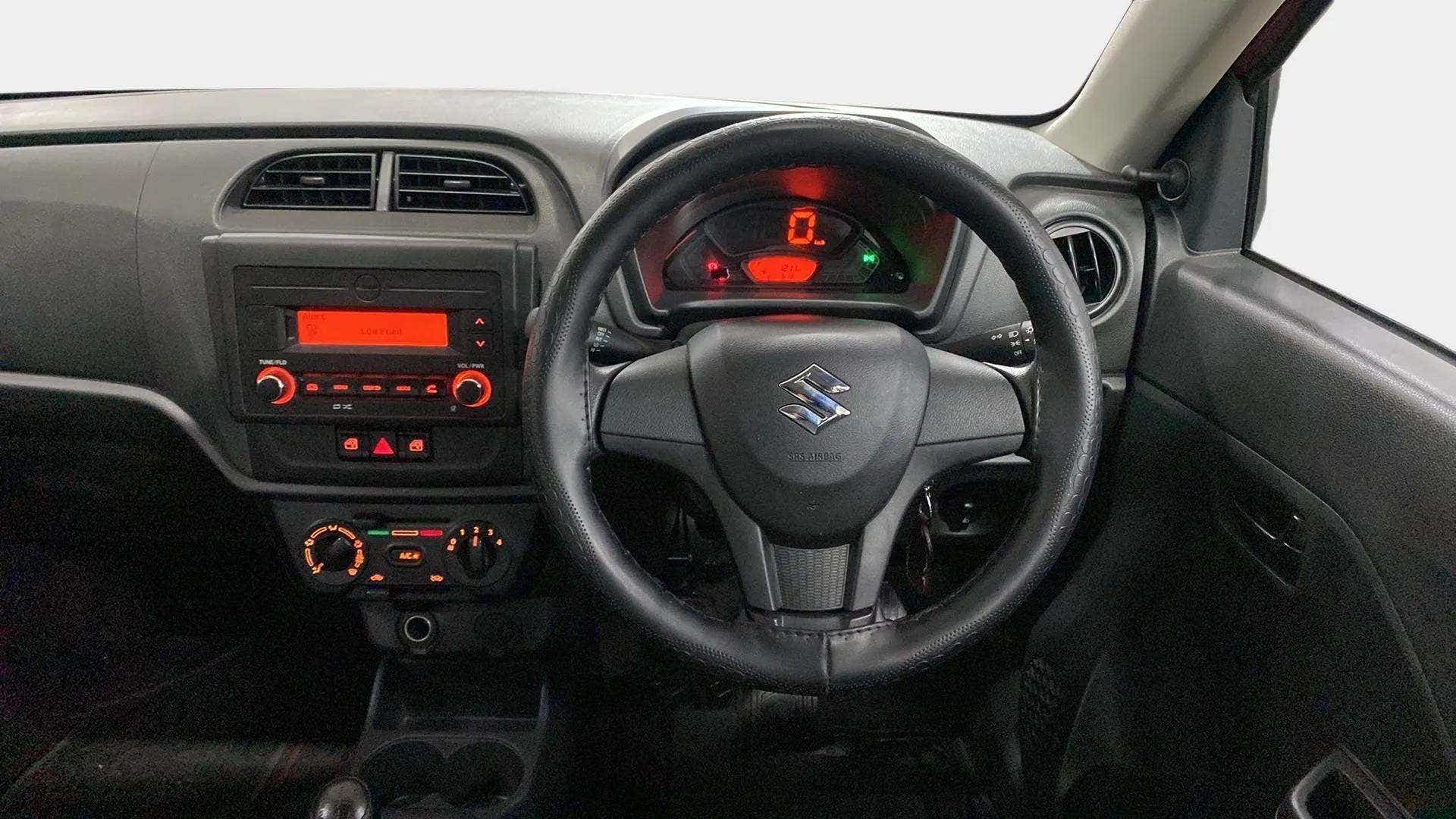 Interior dashboard and steering wheel of a Maruti Suzuki Alto K10