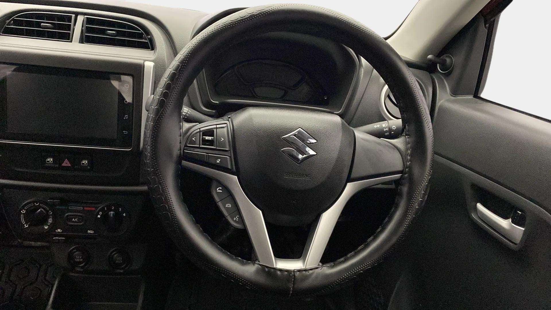 Steering wheel and dashboard of a Maruti Suzuki Alto K10