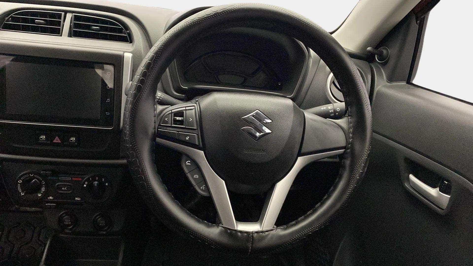 Steering wheel and dashboard of a Maruti Suzuki Alto K10