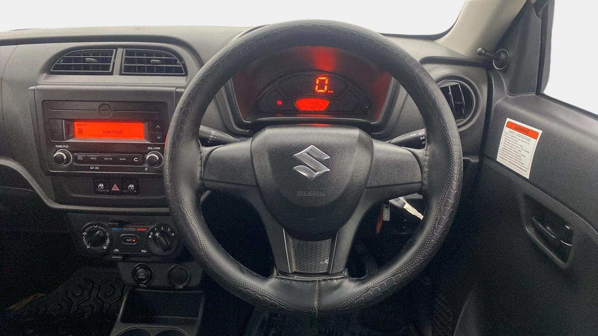 Interior dashboard and steering wheel of a Maruti Suzuki Alto K10