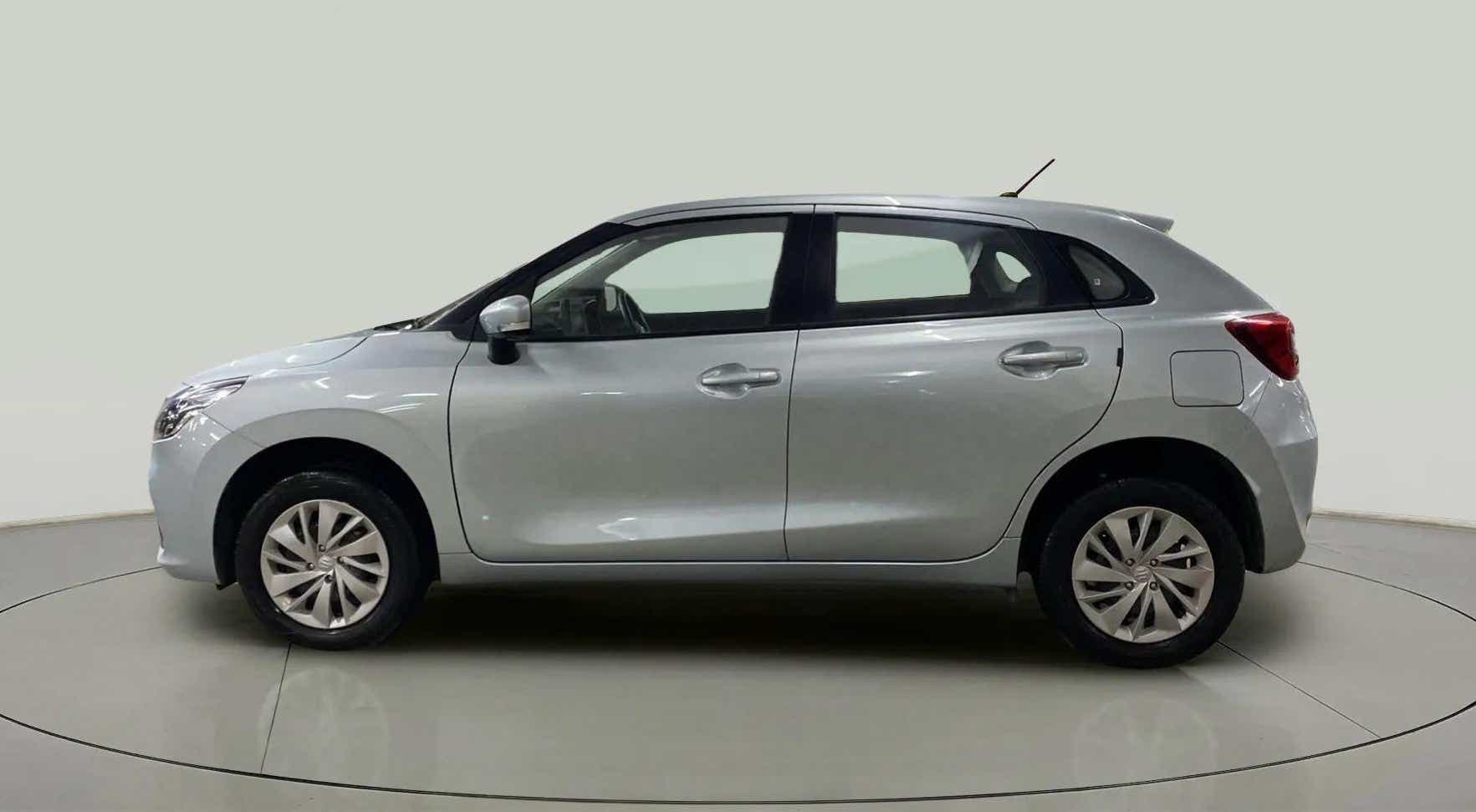 Side view of a splendid silver Maruti Suzuki Baleno