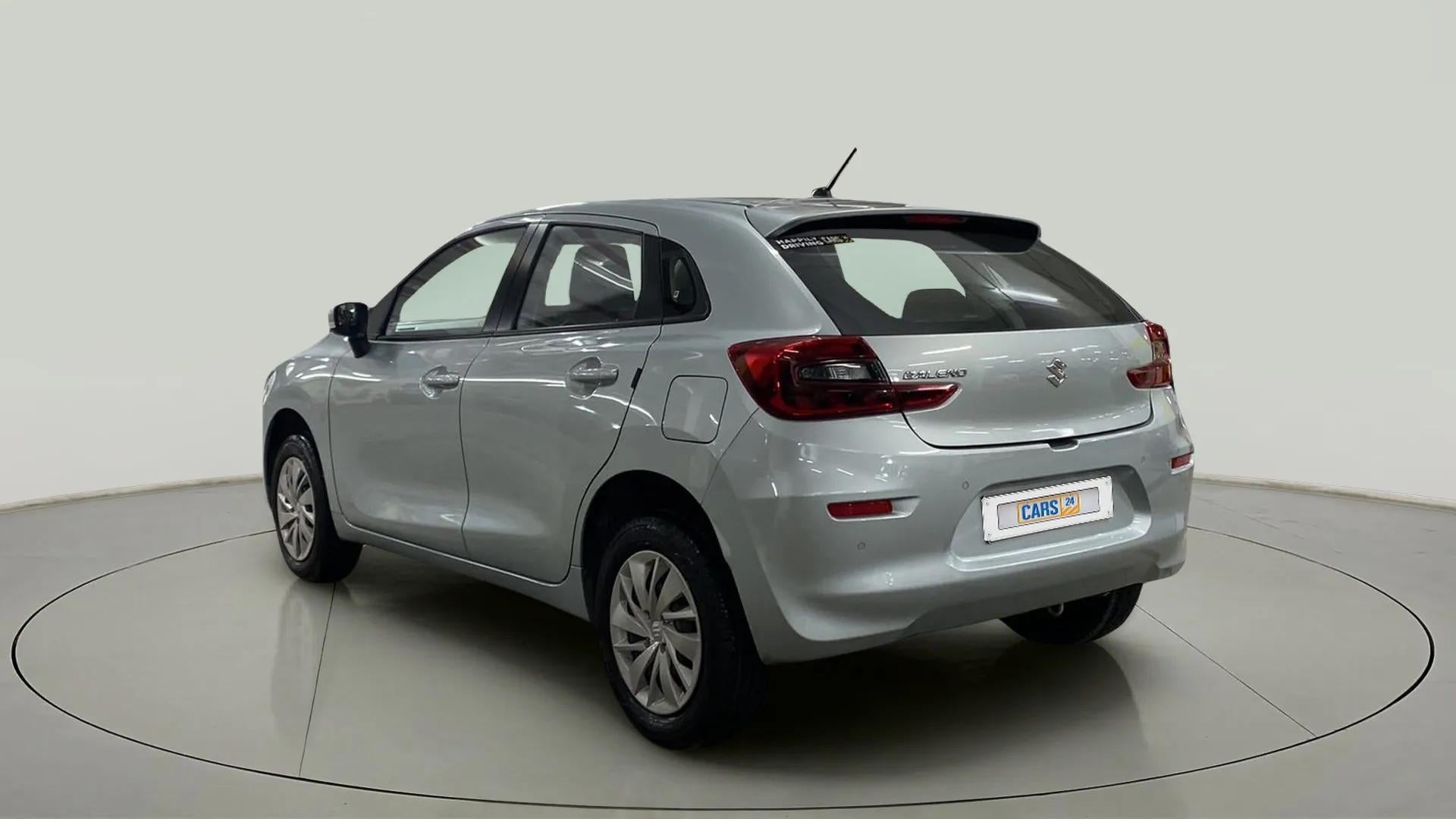 Rear three-quarter view of a Splendid Silver Maruti Suzuki Baleno