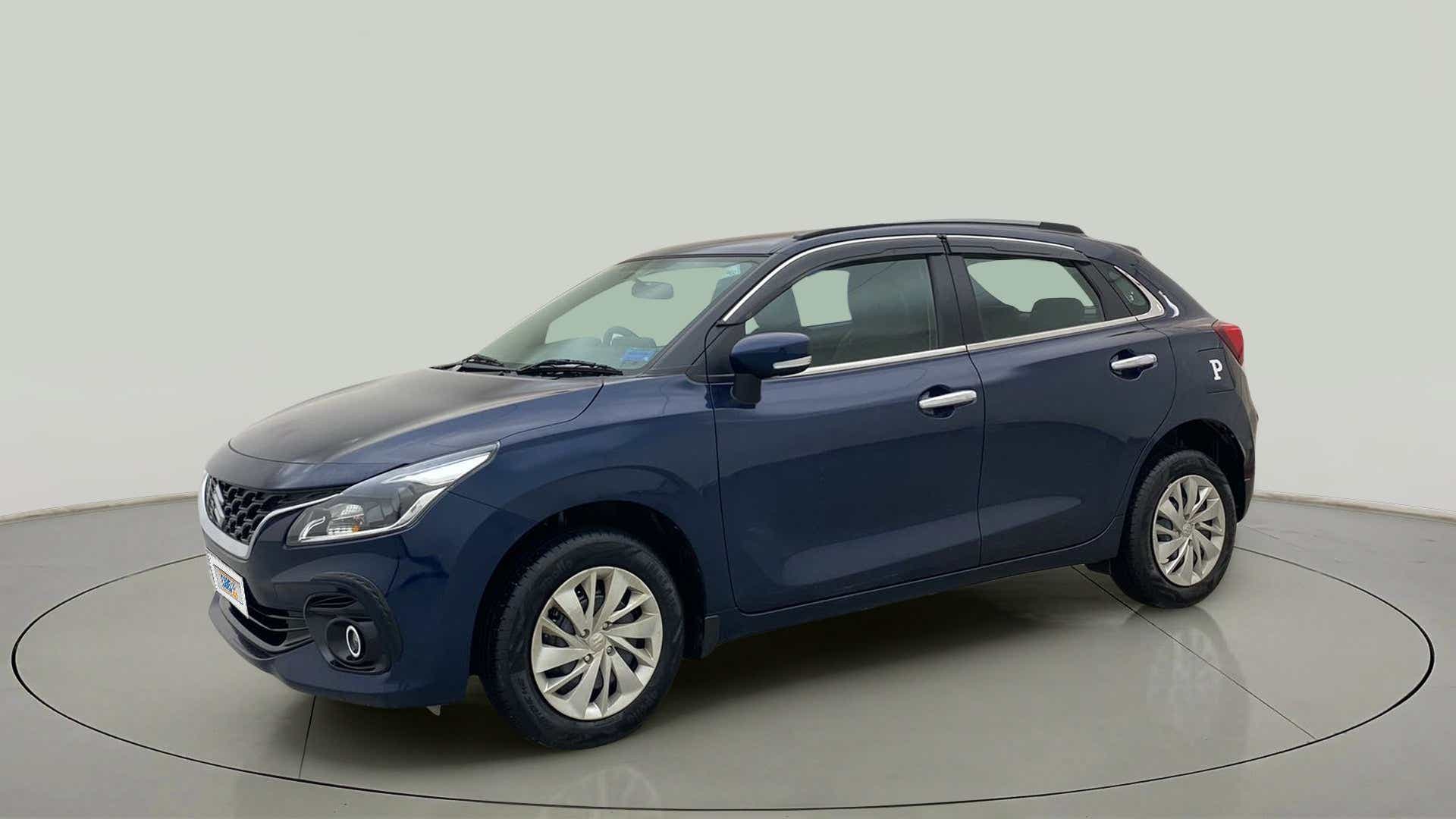 Front and side view of a Nexa Blue Maruti Suzuki Baleno