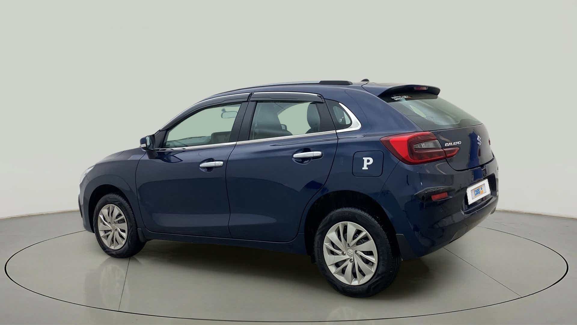 Rear three-quarter view of a Nexa Blue Maruti Suzuki Baleno