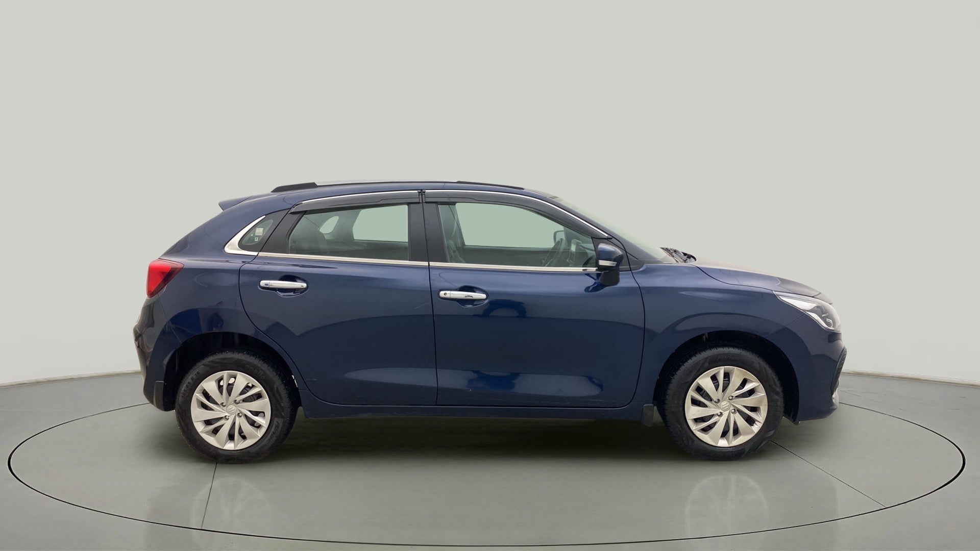 Side view of a Nexa Blue Maruti Suzuki Baleno