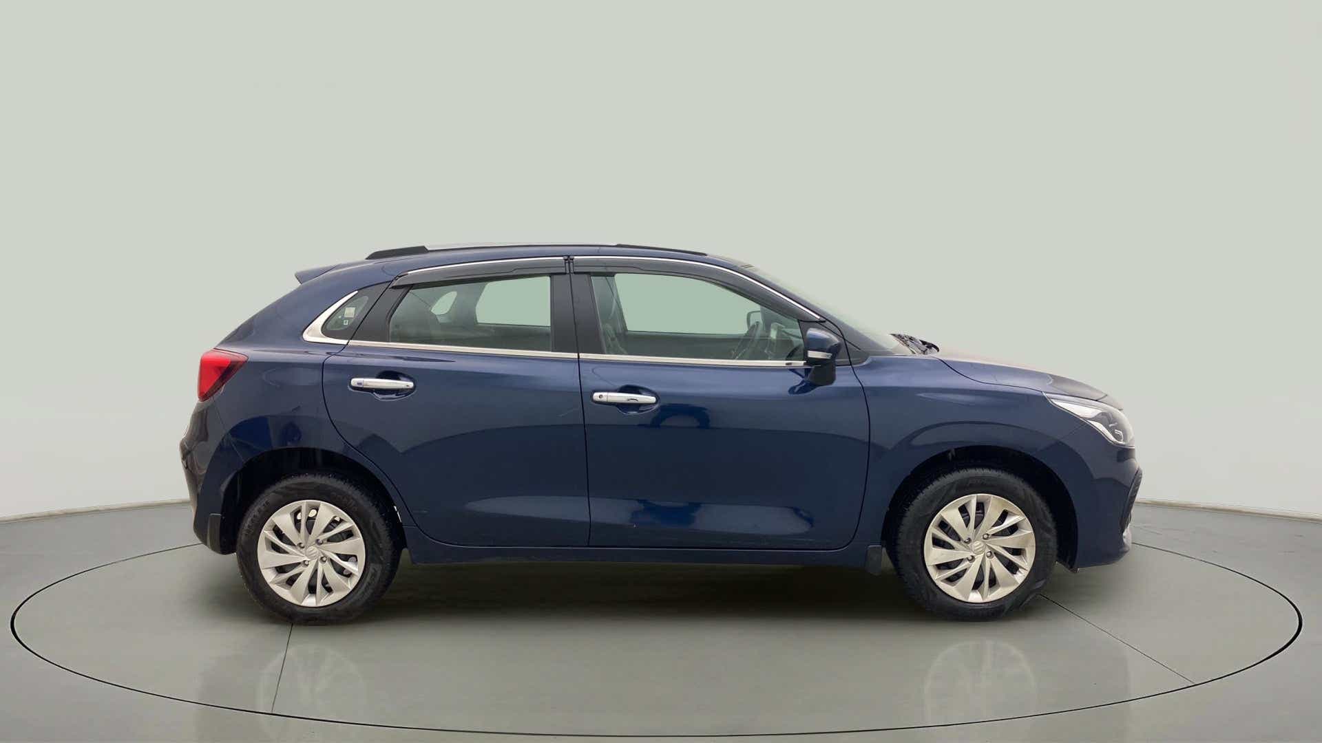 Side view of a Nexa Blue Maruti Suzuki Baleno