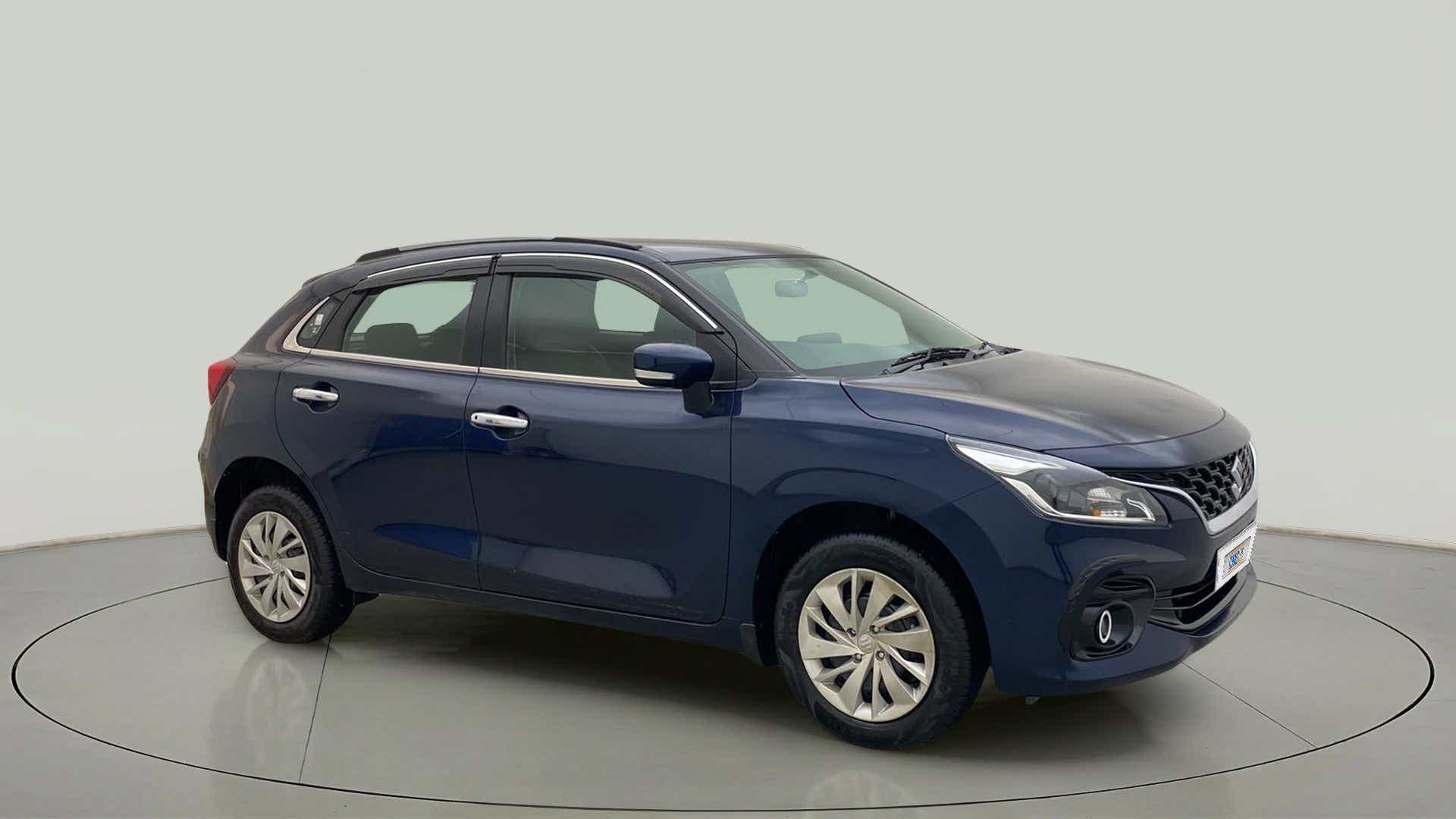 Front three-quarter view of a Nexa Blue Maruti Suzuki Baleno
