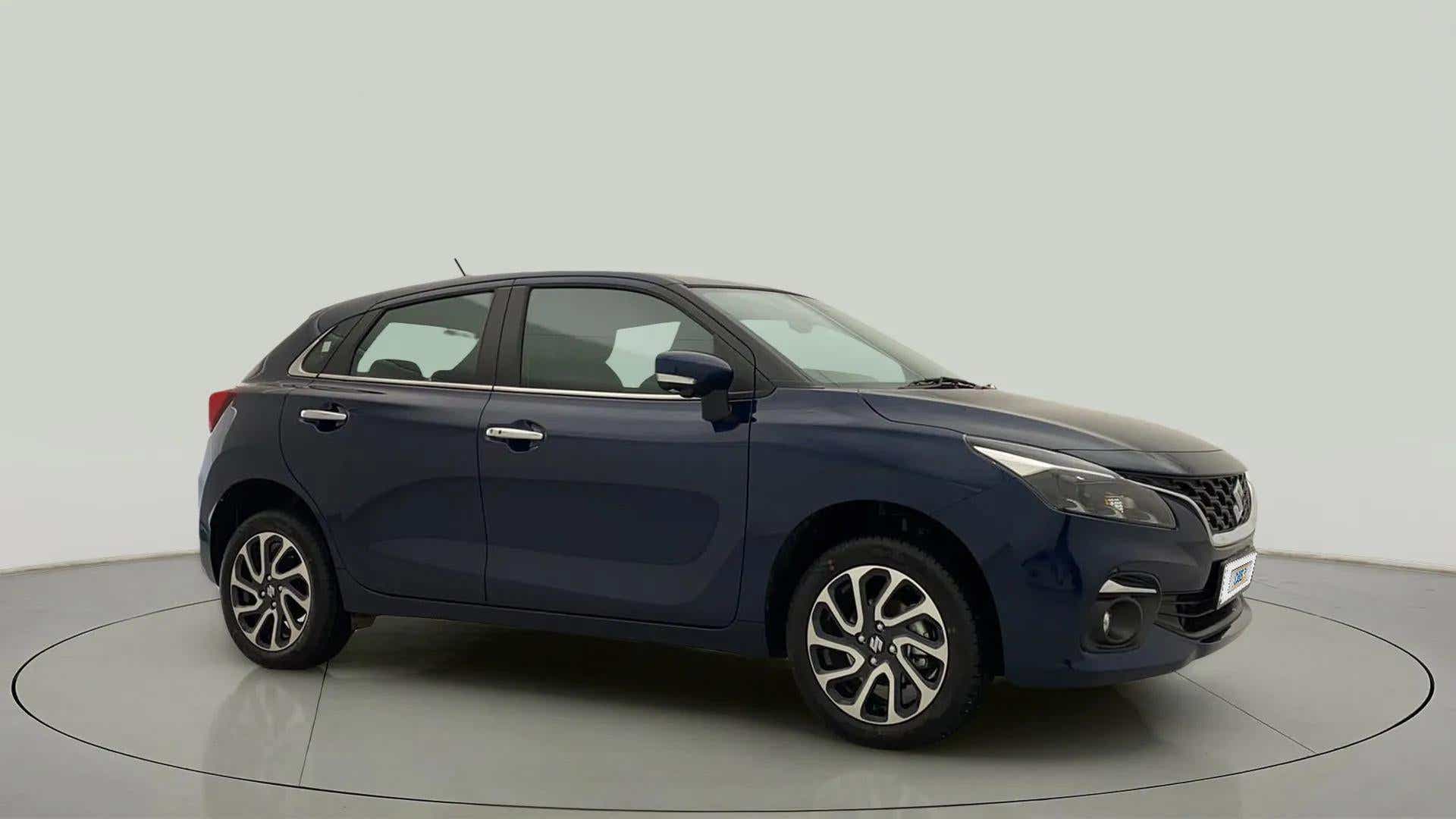 Side profile of a Nexa Blue Maruti Suzuki Baleno