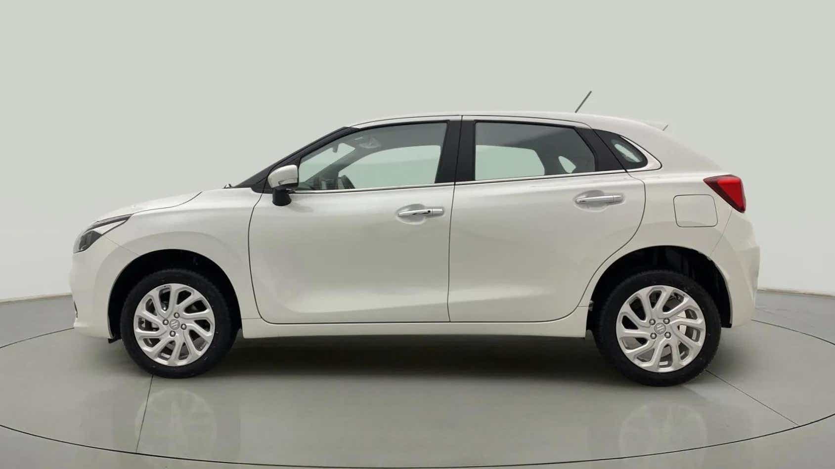 Side view of a Pearl Arctic White Maruti Suzuki Baleno
