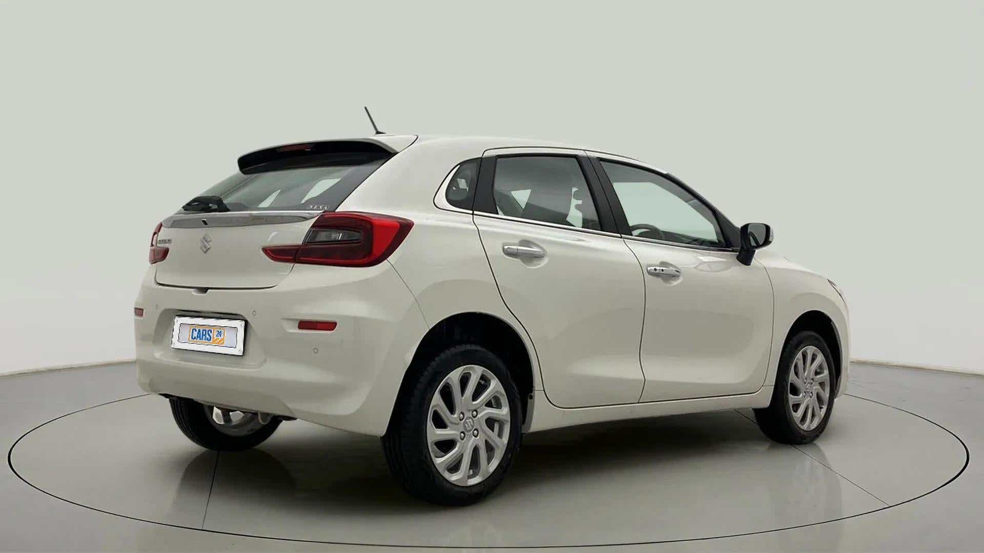 Rear three-quarter view of a Pearl Arctic White Maruti Suzuki Baleno