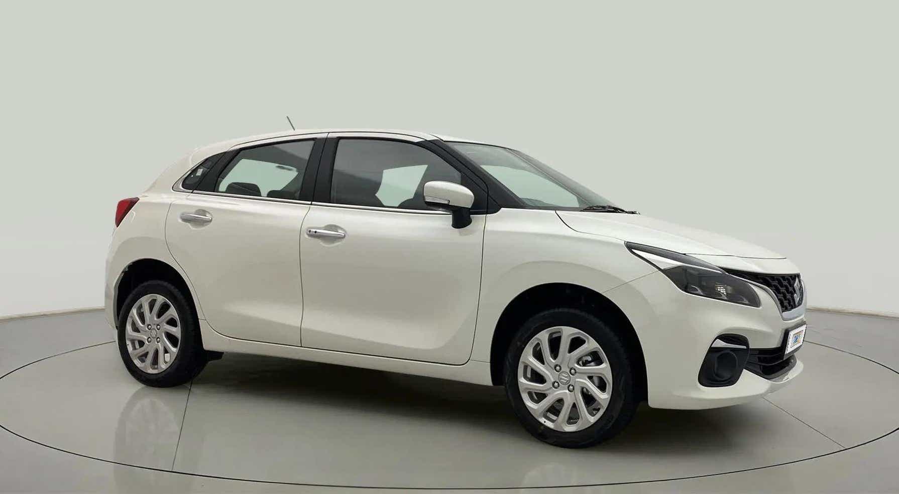 Side profile of a Pearl Arctic White Maruti Suzuki Baleno