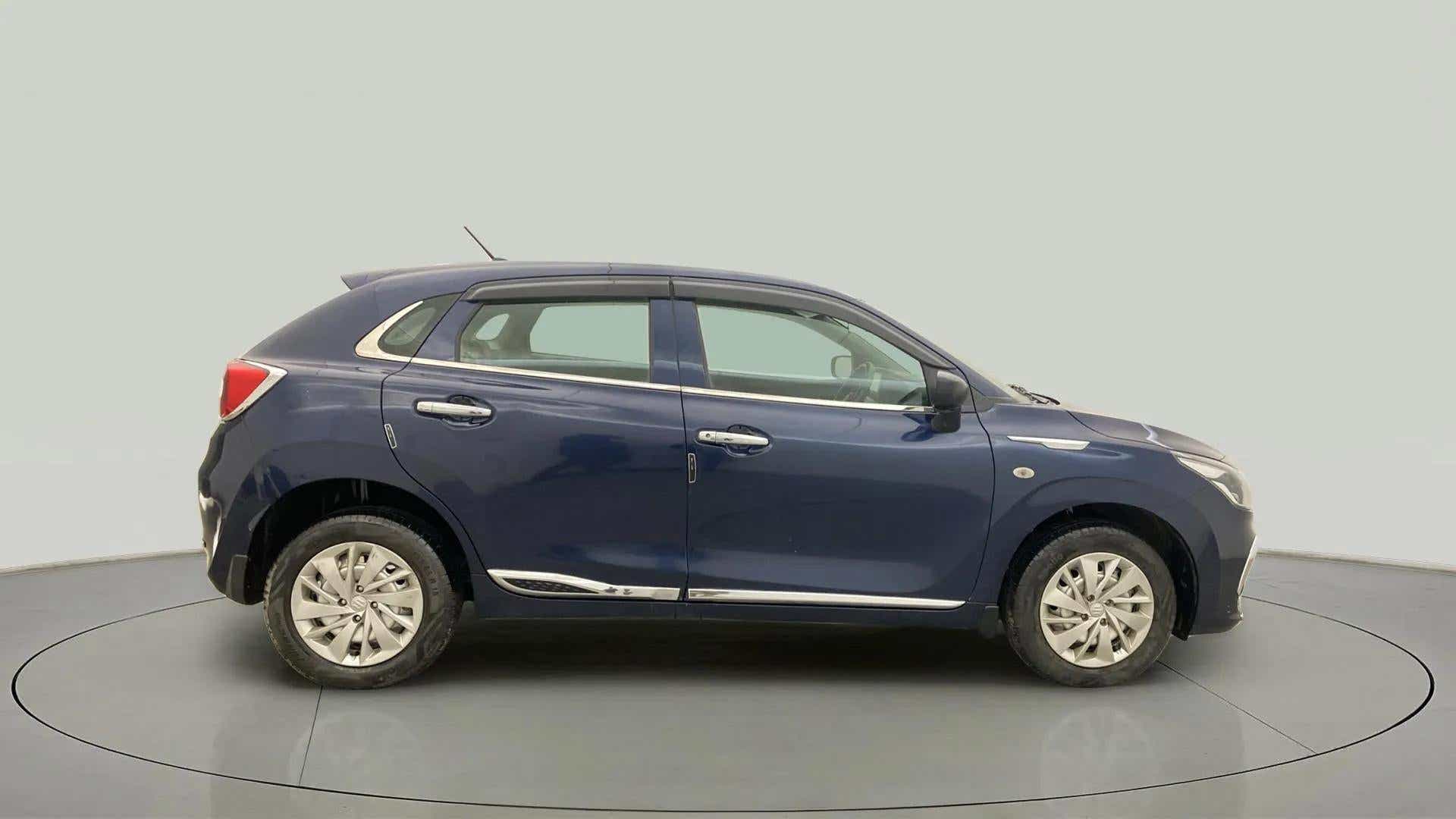 Side view of a Nexa Blue Maruti Suzuki Baleno