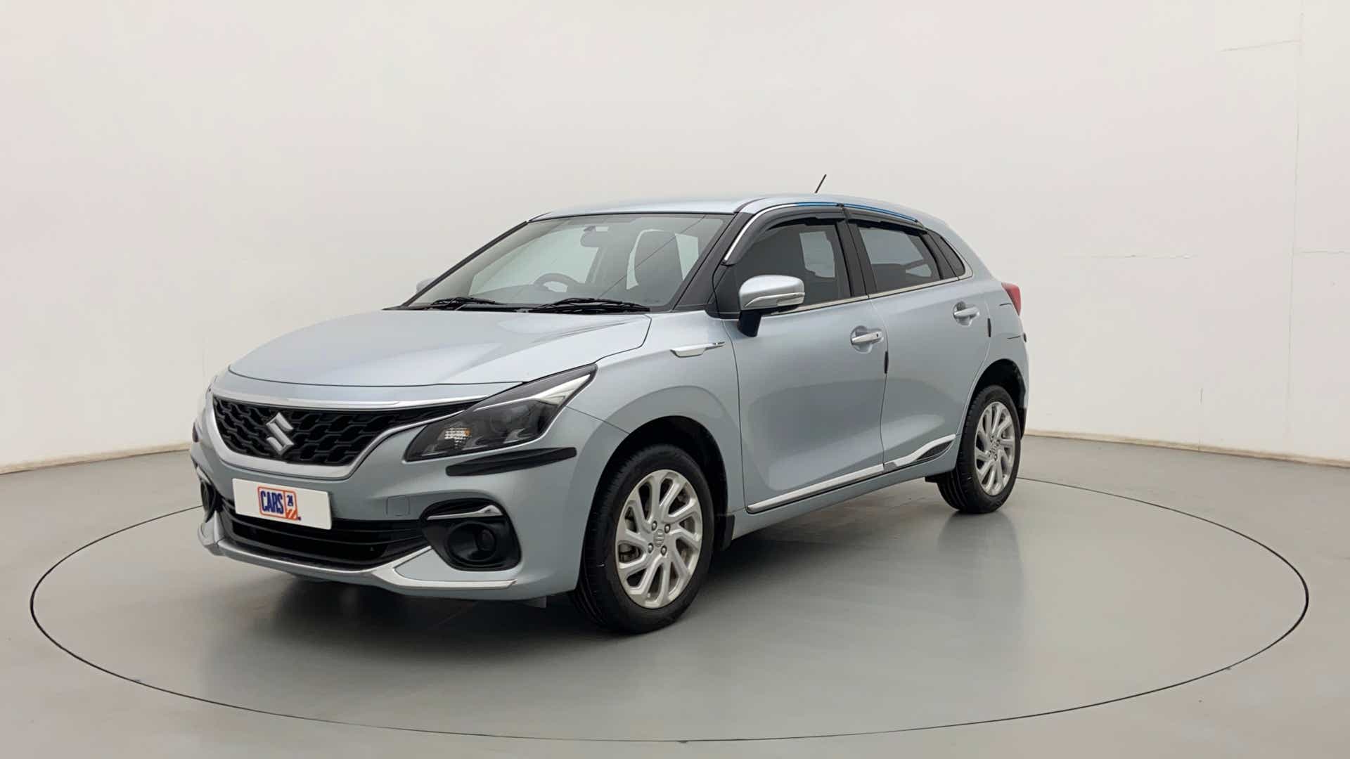 Front three-quarter view of a splendid silver Maruti Suzuki Baleno