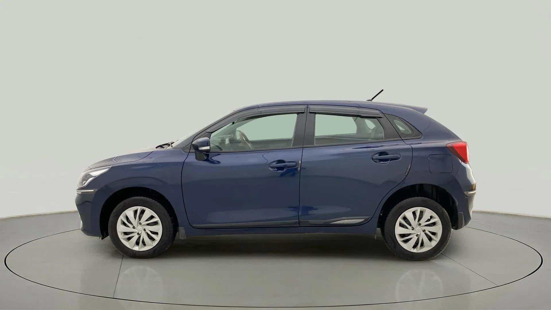 Side view of a Nexa Blue Maruti Suzuki Baleno