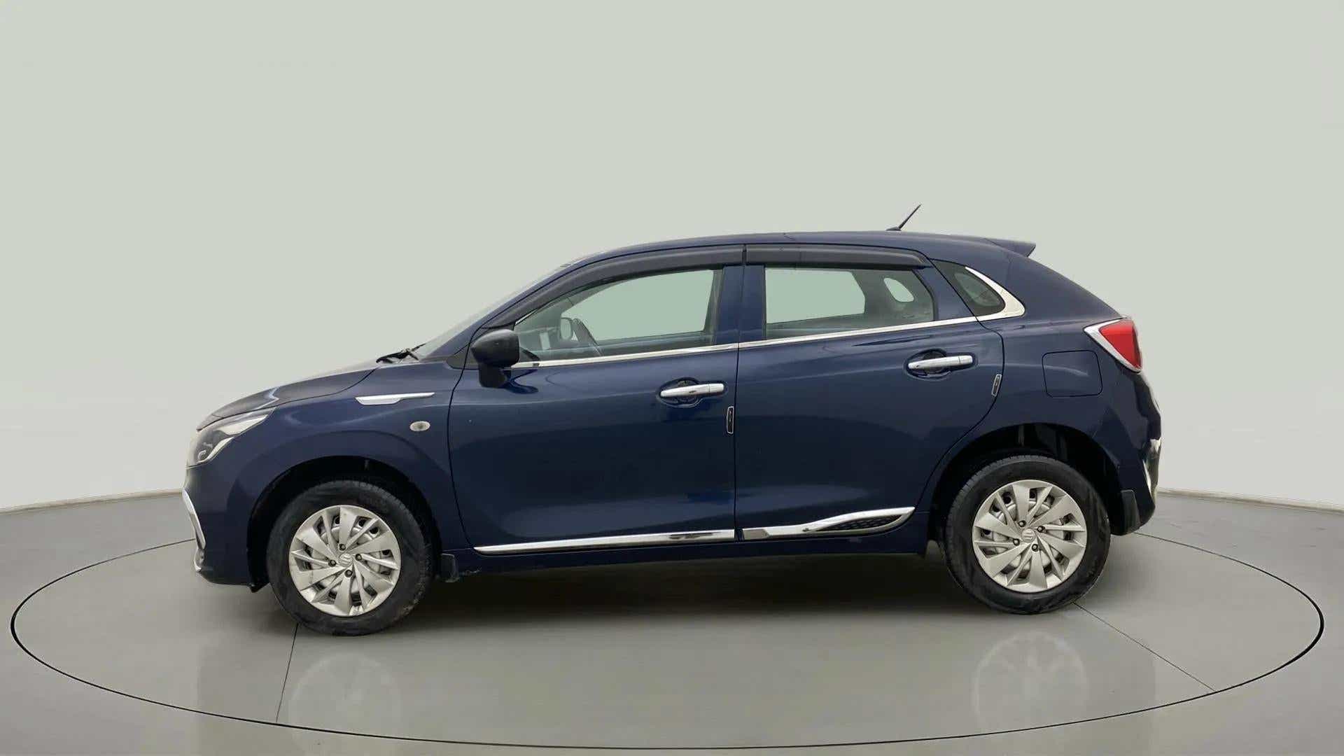 Side view of a Nexa Blue Maruti Suzuki Baleno