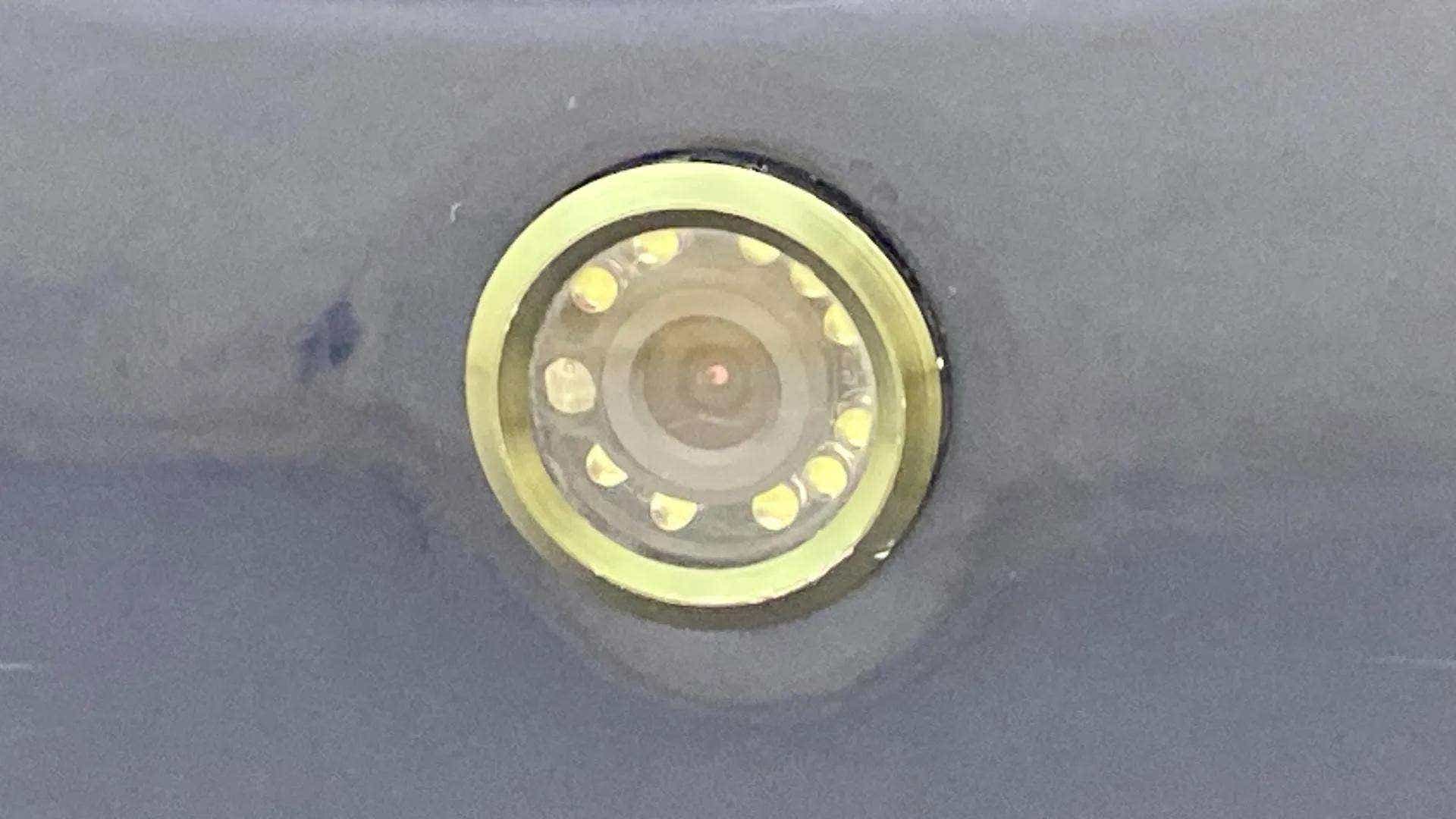 Close-up of a camera lens on a Maruti Suzuki Baleno