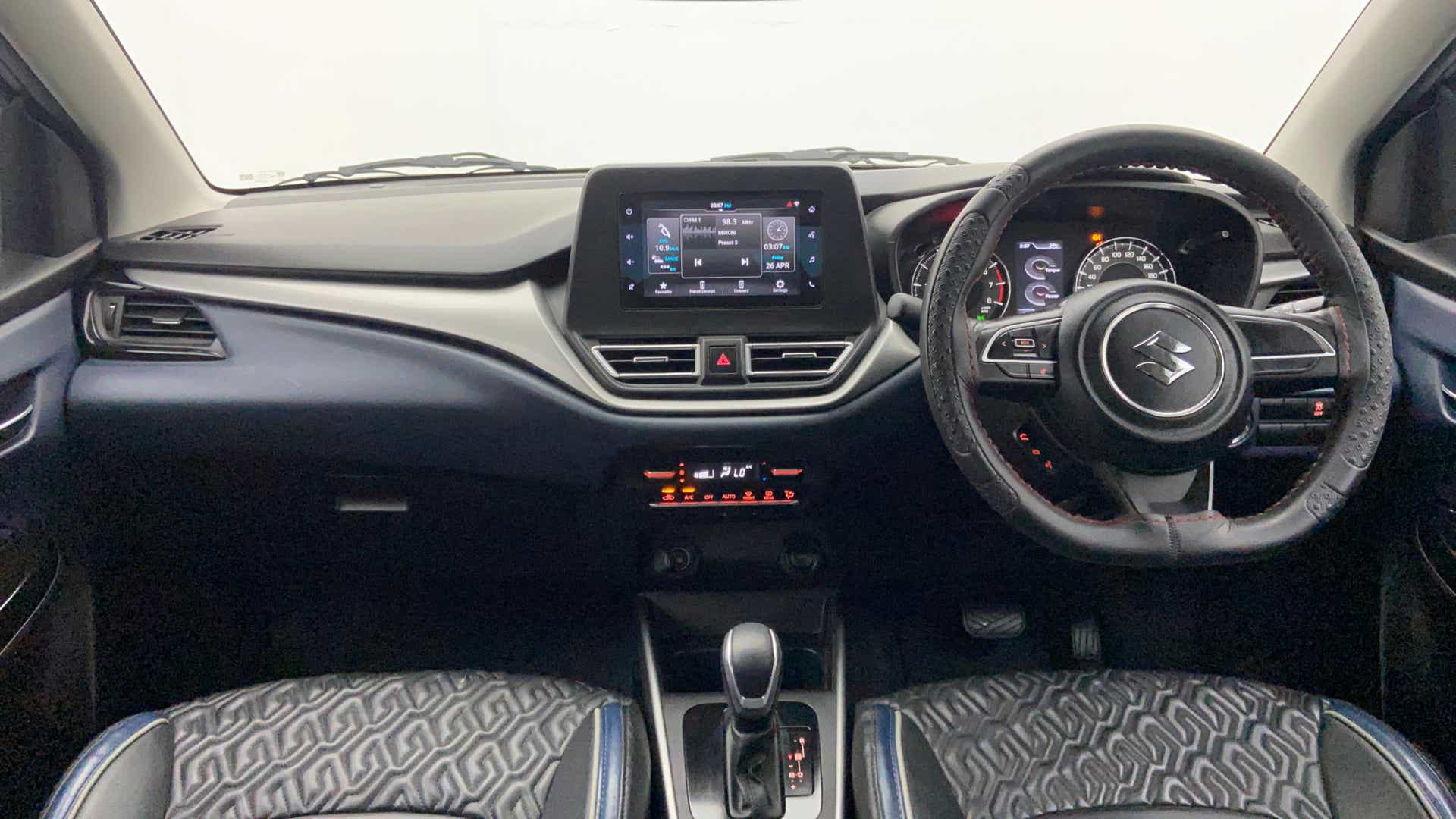 Dashboard and steering wheel of a Maruti Suzuki Baleno