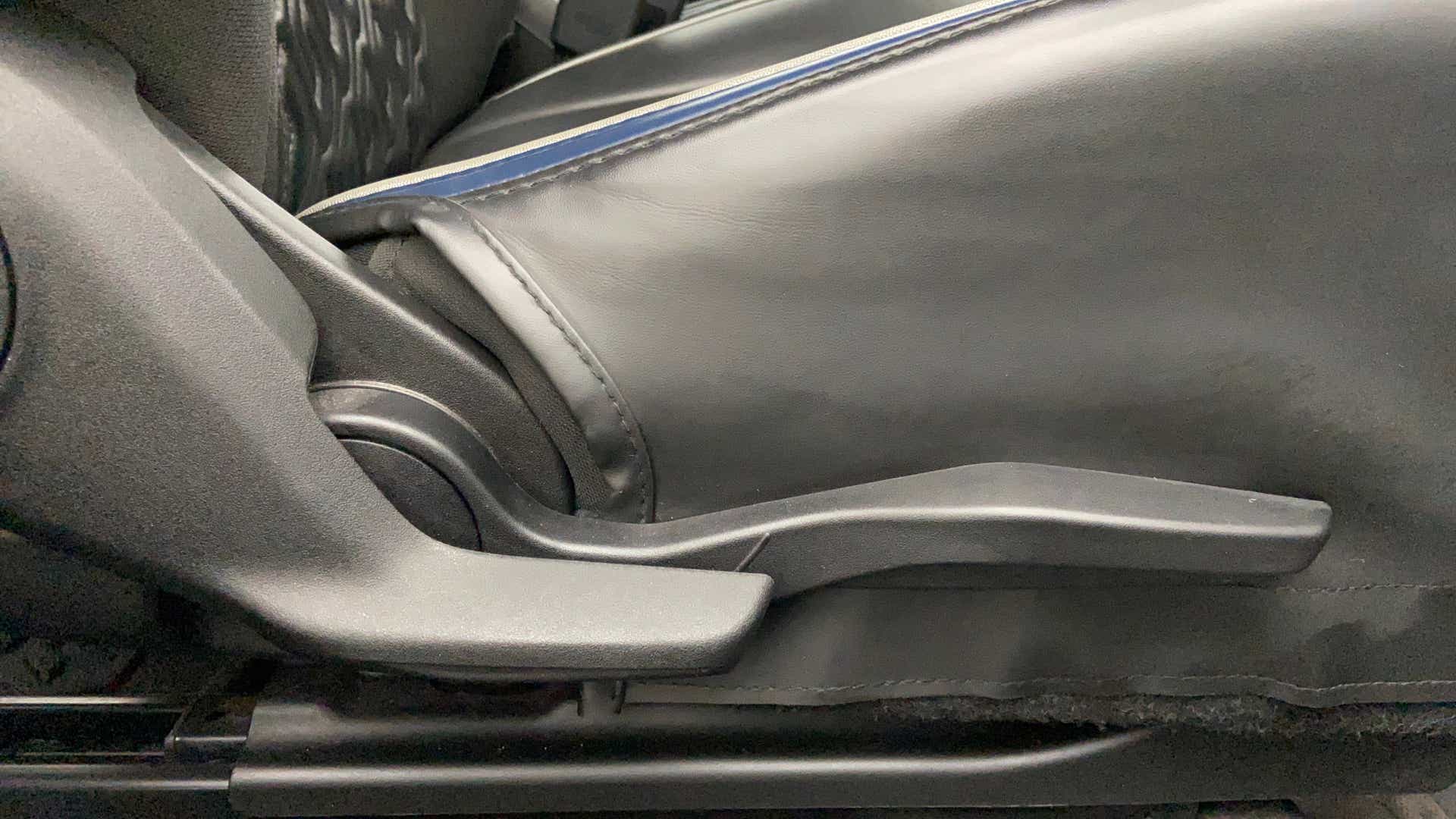 Seat height adjustment lever of a Maruti Suzuki Baleno