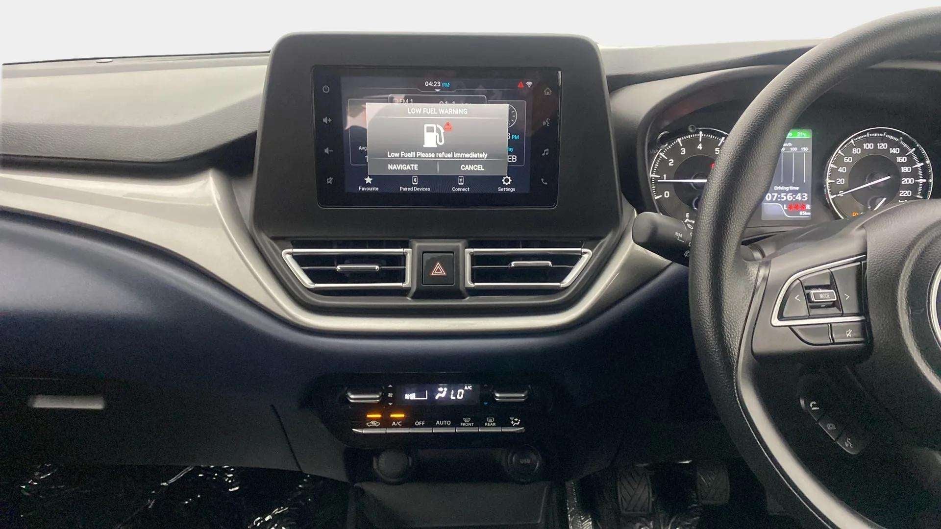 Dashboard and steering wheel of a Maruti Suzuki Baleno